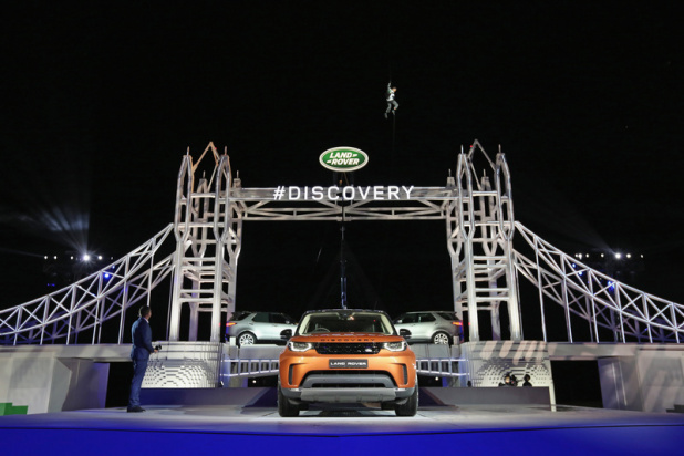 SOLIHULL, ENGLAND - SEPTEMBER 27: Bear Grylls poses as he places the final piece on a Lego structure of Tower Bridge, during the launch of Land Rover's 'New Discovery' at Packington Hall on September 27, 2016 in Solihull, England. Land Rover revealed their brand new Discovery with the help of ambassadors Zara Phillips, Bear Grylls and Sir Ben Ainslie against the backdrop of the replica of London’s Tower Bridge, made entirely from Lego. The structure broke the Guinness World Record for the greatest number of Lego bricks used in a sculpture with over 5.8 million pieces. （Photo by Dan Kitwood/Getty Images for Land Rover） *** Local Caption *** Bear Grylls